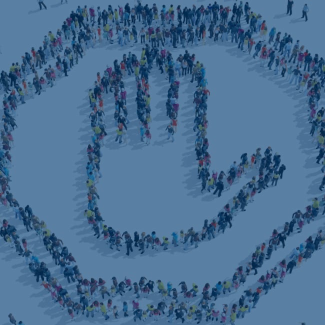 an overhead picture of a stop sign formed by people
